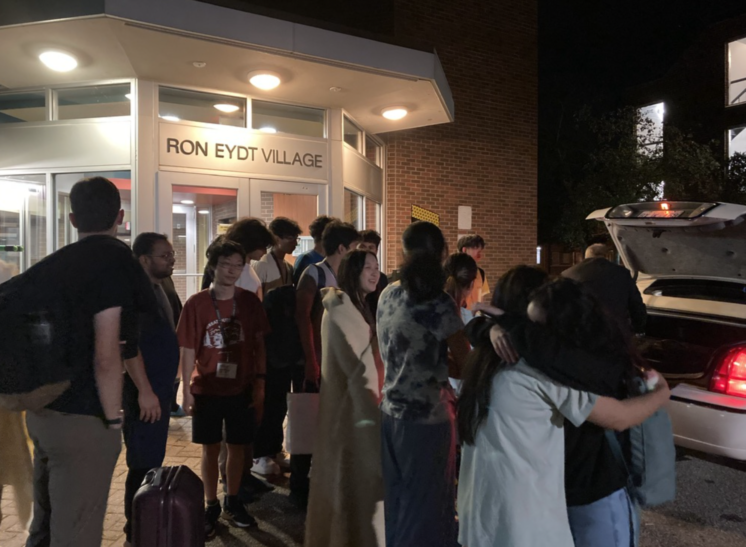 Saying goodbye outside Ron Eydt Village